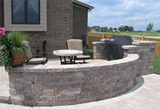 Curved paver patio with wall
