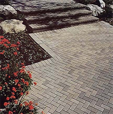 Herringbone pattern walkway of gray pavers