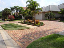 U-shaped driveway of red brick pavers